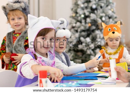 Group of funny kids prepare to x-mas holiday. Children weared animal costumes