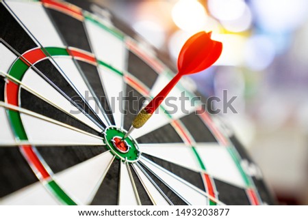 Darts board with arrows hitting the center target, focuses on success, planning to be smart concept.

