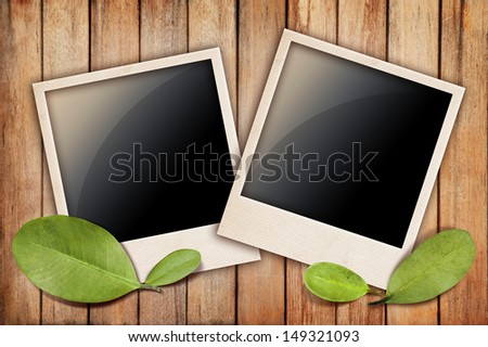 Wood texture with dry leaf and photo frame 