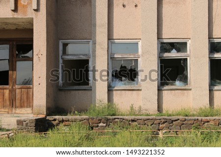 Old abandoned office building with broken windows
