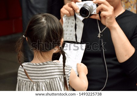 Little Japanese girl posing for the pictures