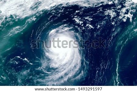 Super typhoon over the ocean. The eye of the hurricane. View from outer space  Some elements of this image furnished by NASA Royalty-Free Stock Photo #1493291597