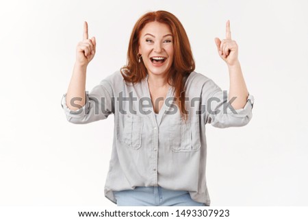 Charismatic good-looking happy lucky redhead middle-aged woman laughing amused joyfully giggle pointing raised hands up awesome hilarious prices good promo look camera excited, white background