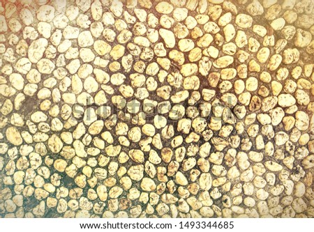 Yellow stone abstract background, retro toned photo. Tiny marble gravel template. Pebble texture. Marine or seaside construction material. Stone mosaic natural backdrop. White pebble surface top view