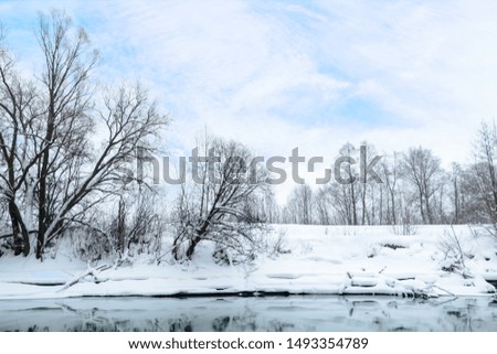 The Kazanka River at the confluence of the streams from the famous Blue Lakes. This area of river do not freeze in winter and feed from Blue Lakes with groundwater. Russia, Kazan. Winter landscape.
