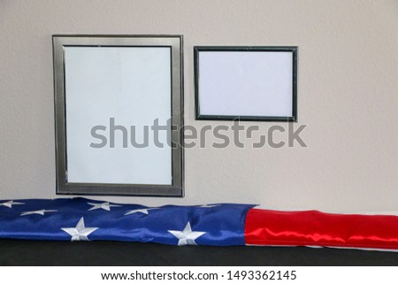 American flag Laid Out Under Picture Frames