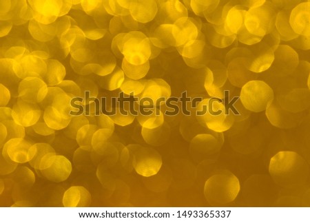 Abstract Christmas background wallpaper diamond and effect lighting for design. Golden bokeh glitter lights