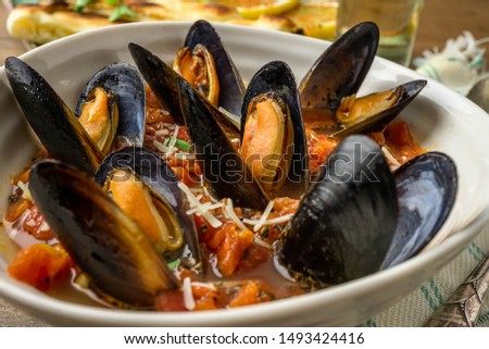 Mussels in wine and garlic broth. Close up, above shot, flat lay