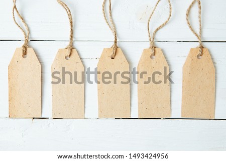 The five card badges with ropes on wooden table