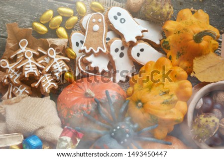 Happy Halloween card. ginger cookie, bag of sweets and candies shape ghost and skeleton with pumpkins and sweets