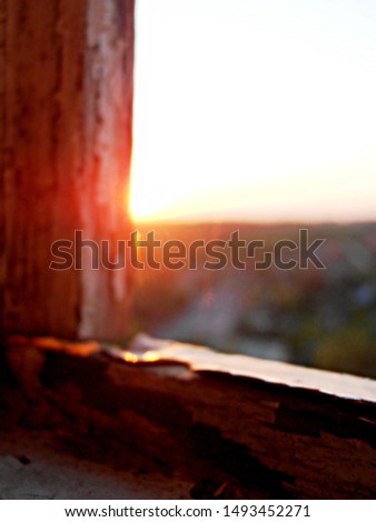 Dawn in the summer. Beautiful morning. Old wooden window. Art.