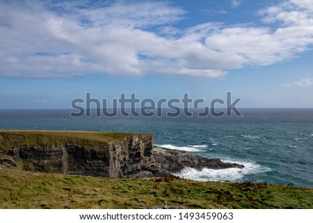 Waves crashing of the rocks of the Mizen head West Cork Ireland  Royalty-Free Stock Photo #1493459063