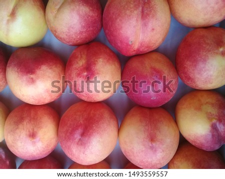 Macro Photo food tropical fruit peach. Texture background of sweet red ripe peaches. Image food fruit peaches