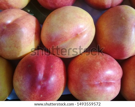 Macro Photo food tropical fruit peach. Texture background of sweet red ripe peaches. Image food fruit peaches