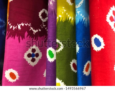 Batik is the art of painting cloth using wax and natural or artificial coloring. Close up colourful and beautiful batik fabric. Javanese batik. Indonesian batik.