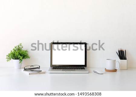 Office desk Workspace stuff with notepad, laptop and coffee cup mouse notepad shot. Royalty-Free Stock Photo #1493568308