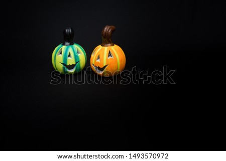 ghost and pumpkins halloween and day of the dead symbols with black background