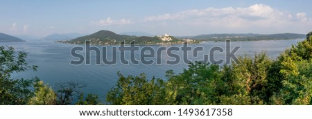 Stunning panoramic view of the southern part of Lake Maggiore on a sunny day, Italy
