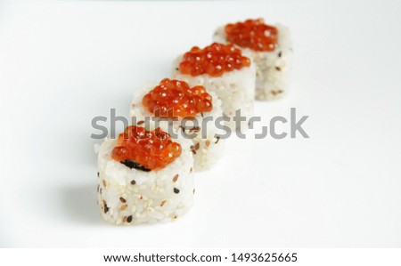 Sushi and rolls with seafood. Delicious Japanese dish with red caviar to order at home