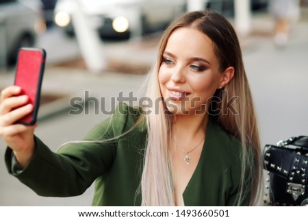 young woman making selfie with smartphone