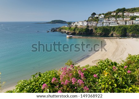 Looe beach Cornwall England with blue sea on a sunny summer day Royalty-Free Stock Photo #149368922