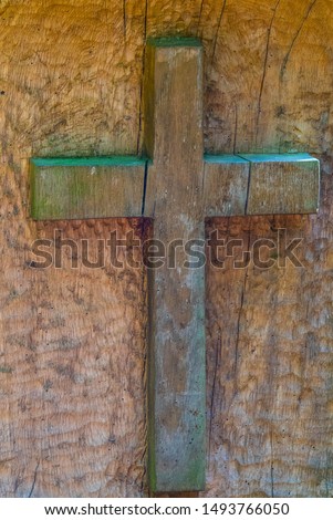 wood cross on wooden background