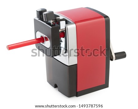 Red mechanical pencil sharpener with red pencil isolated on a white background. Royalty-Free Stock Photo #1493787596