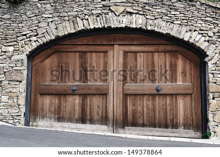 Old antique door in the stone wall