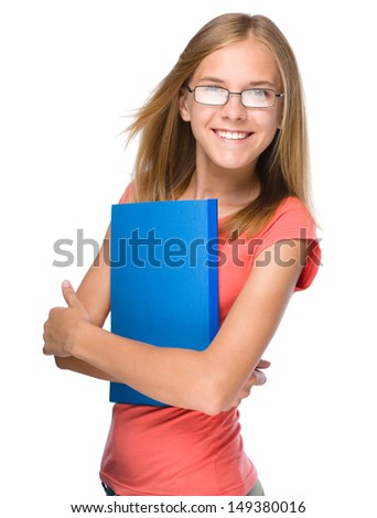 Young skinny student girl is holding exercise books, isolated over white
