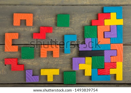 Creative solution for idea - business concept, jigsaw puzzle on the wooden background Royalty-Free Stock Photo #1493839754