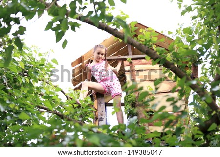 Wooden tree house for children in the spring forest