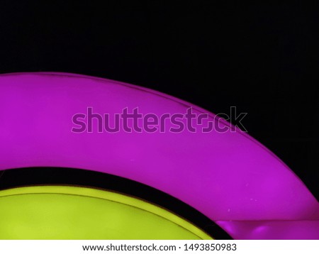 Pink and Green lamp with black background