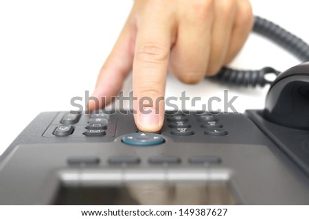 man hand is dialing a phone number, top view