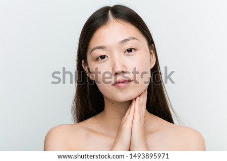 Close up of a young beautiful and natural asian woman