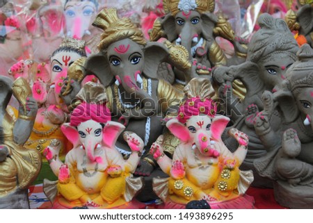 A Beautiful clay statue/Idol of an Indian god Lord Ganesha decorated with multi colors