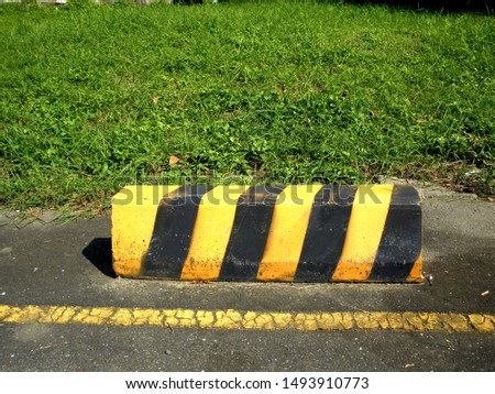 Yellow black traffic isolated bricks: traffic sign background and texture concept