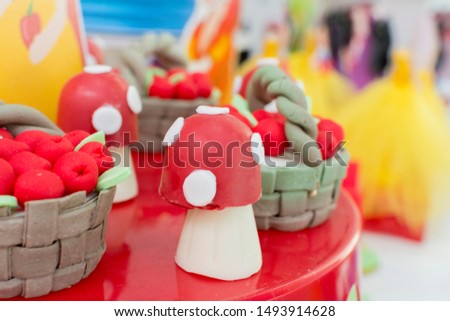 Colorful decor of a mushroom with a red roof. Fairy tale. Snow White and The Seven Dwarfs Children's Party. Decoration of children's party of girl, background for various uses.