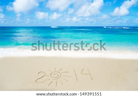 Number 2014 on the sandy beach by the ocean