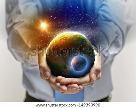 Close up image of human hands holding earth planer. Ecology concept. Elements of this image are furnished by NASA