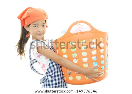 Child carrying laundry basket