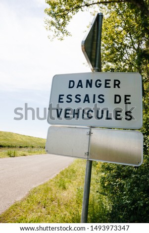 Danger, Essais de vehicules translated freom French as Danger, new vehicles testing near the dedicated for tests highway in France