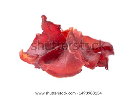 Pork jerky isolated on white background. Pieces of dry meat. Close-up. Clipping path.