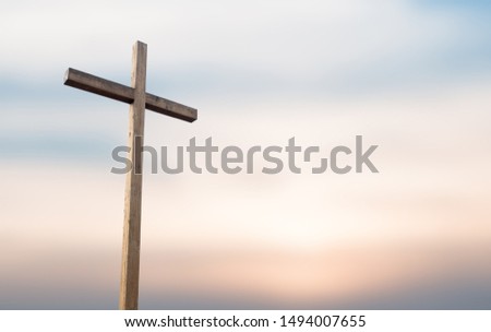 Wooden cross over white background