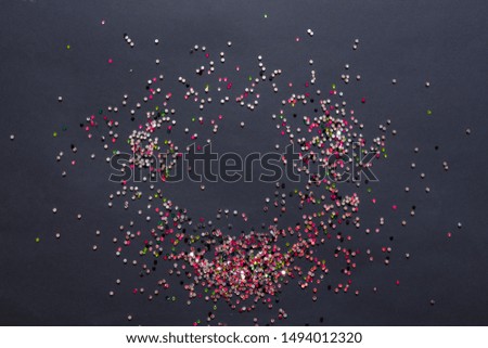 Festive background, round frame of multi-colored glitter on a black background, Halloween, Christmas