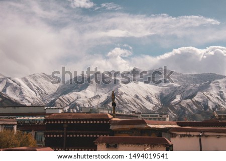 Travel photography from Lhasa, Tibet to Nepal. Beautiful views of high altitude landscapes, lakes, monastery, Everest Base Camp, the Himalayas, Tibetan prayer flags, snow peaks and mountain ranges. 