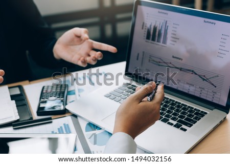 Colleagues are stress talking about the results report and compared with the financial information on the laptop screen. Royalty-Free Stock Photo #1494032156