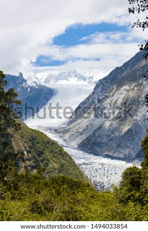Franz Josef Glacier and valley surrounds on a bright summer day in New Zealand