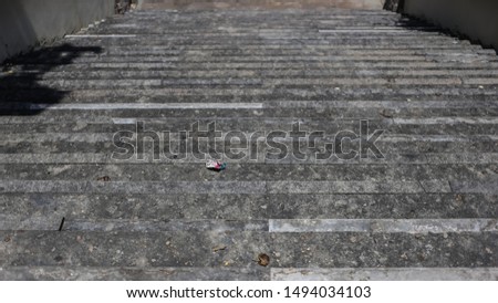 Dark stairway , old walk way  , Cigarette pack