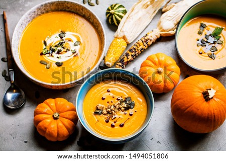 Vegetarian autumn pumpkin cream soup with seeds