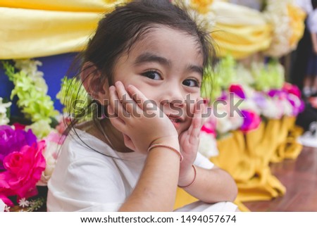 happy little girl sitting on the floor